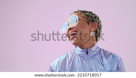 Happy black woman, beauty and fashion sunglasses, retro and cool vintage look. Model, female and unique style, costume or designer jacket outfit and jewelry isolated on pink studio mockup background. Royalty-Free Stock Photo #2210718057