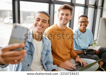 Selfie with phone, group of male students smile and take video for social media together with laptop. University, technology and education, happy young man with smile taking picture of class friends.
