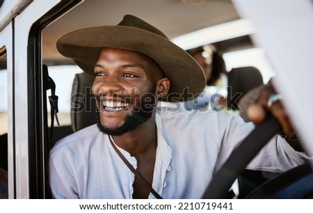 Happy, taxi and driver with black man driving and enjoying career, safari tour guide in vehicle. Adventure, travel and smile african american looking excited while touring with passenger, carefree Royalty-Free Stock Photo #2210719441