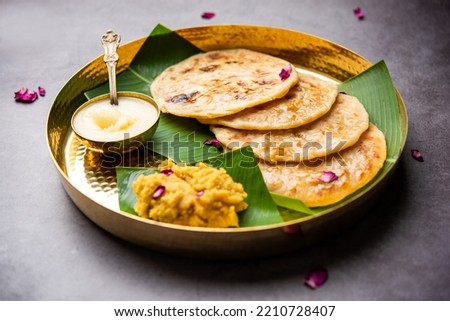 Puran poli, Puran roti, Holige, Obbattu, or Bobbattlu, is Indian sweet flatbread from Maharashtra Royalty-Free Stock Photo #2210728407