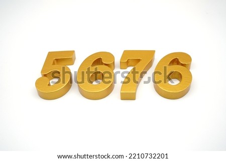     Number 5676 is made of gold-painted teak, 1 centimeter thick, placed on a white background to visualize it in 3D.                              