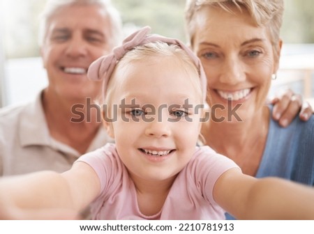 Girl, grandparents and family selfie portrait in home having fun spending quality time together. Love, support and grandma, grandpa and kid taking a picture, bonding and smile, laughing and joy.