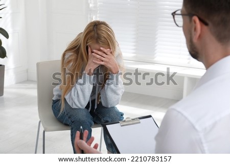 Psychotherapist working with drug addicted young woman indoors Royalty-Free Stock Photo #2210783157