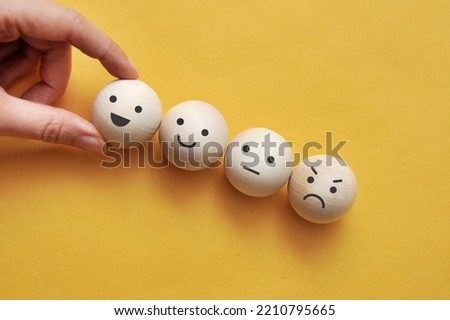 A variety of emotions: joy, serenity, anger, sadness wooden ball