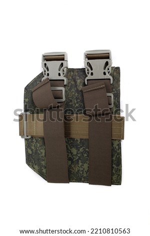 Pockets and holders on the body armor of a soldier on the background