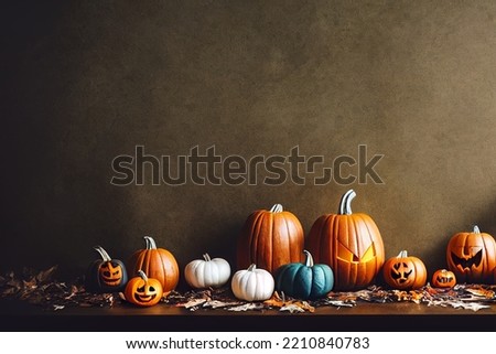 Pumpkins in foliage for Halloween holiday lying on the floor. Spooky drawings on pumpkins.
