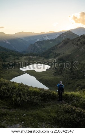 Panormaic view over two mountain lakes during sunset, Northern Italy
