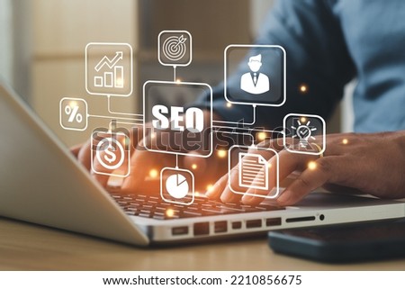 Businessman using a computer for analysis SEO Search Engine Optimization Marketing Ranking Traffic Website Internet Business Technology Concept.
 Royalty-Free Stock Photo #2210856675