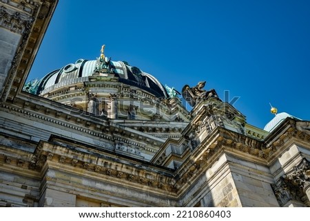 Impressive religious architecture: view from below to the staggered facade and the cupola of the Berlin Cathedral Royalty-Free Stock Photo #2210860403