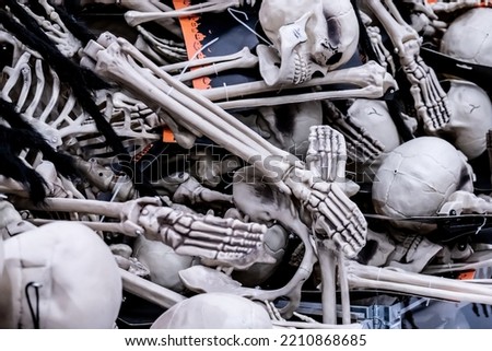 Plastic skeletons warming up at a store before halloween.