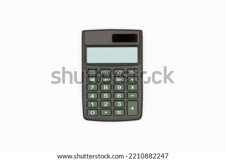 Calculator with brown buttons and empty digital screen on a white background. Isolated. Solar powered financial calculator. Electronic machine for math calculations. Business office supplies. Close-Up