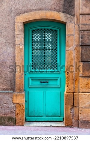 Old and beautiful ornate door, classic architectural detail found in metz, France Royalty-Free Stock Photo #2210897537