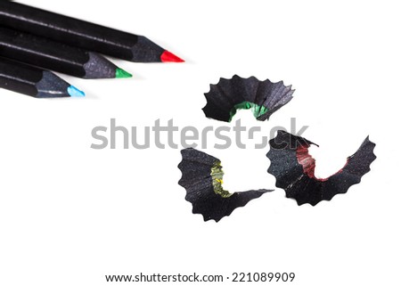 Studio shot of some color pencils with savings, isolated on white background. 