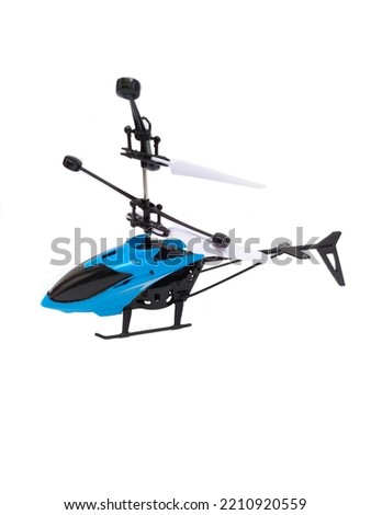 Toy helicopter in blue and black on a white background 