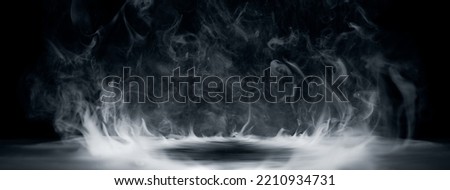 Real smoke exploding outwards with empty center. Dramatic smoke or fog effect for spooky Halloween background. Royalty-Free Stock Photo #2210934731