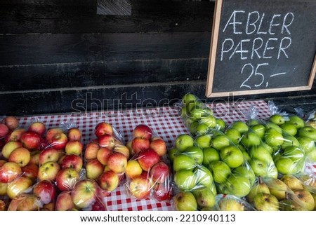 Svendborg, Denmark A roadside stand sells apples  and pears in the fall with signs and prices in Danish.