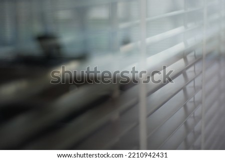 Blur focus of Metal blinds on the window. The texture of blinds. Blinds background.