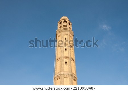 Minaret of a mosque in the historic center of Tozeur, Tunisia. Royalty-Free Stock Photo #2210950487