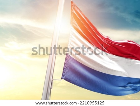 Netherlands national flag cloth fabric waving on the sky with beautiful sunlight - Image