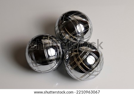 Silver petanque ball and white background
