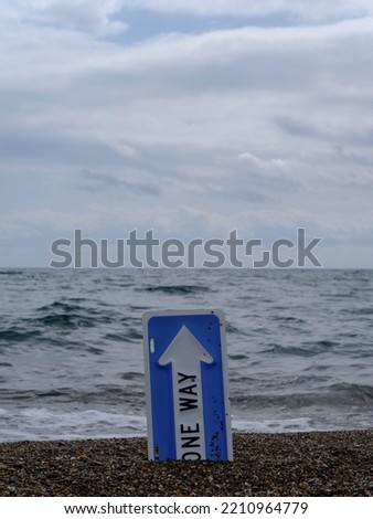 one way sign on the beach