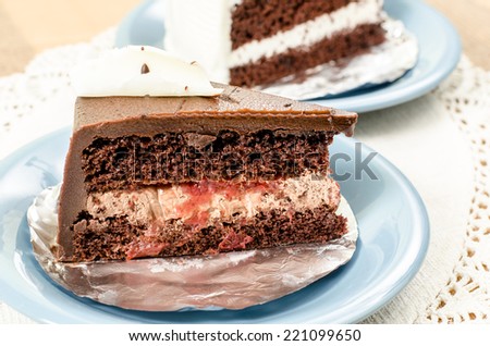 Image of chocolate cake in ceramic dish on   fabric