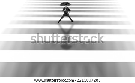 Wide angle shot of a man walking down the street, minimalistic shot, a man walking in his imaginary world, artistic designs on the wall, high-quality image. Black and white image.;