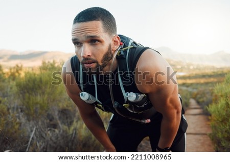 Sweating, breathing and tired fitness man running outdoors with fatigue, body challenge and struggle for exercise. Male runner athlete, mental break and nature trail rest to breathe in mindset focus Royalty-Free Stock Photo #2211008965