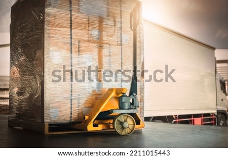 Packaging Boxes Wrapped Plastic Stacked on Pallets Loading into Cargo Trucks. Shipping Trucks. Supply Chain Shipment Boxes. Distribution Supplies Warehouse. Freight Truck Transport Logistics. Royalty-Free Stock Photo #2211015443
