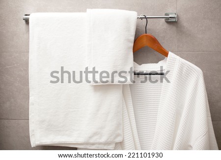 towel and robe on the rack in the bathroom Royalty-Free Stock Photo #221101930