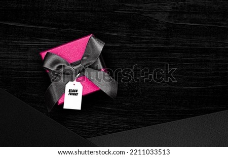 gift box with tag on black background