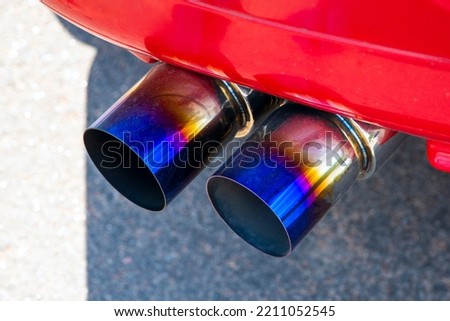 double exhaust pipe of a red car. High quality photo