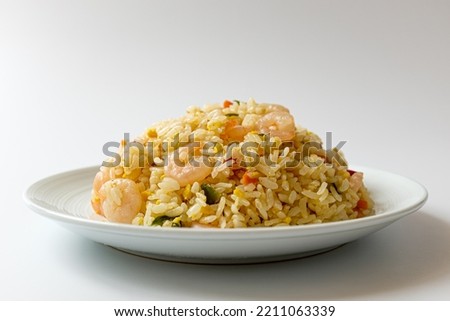 Shrimp fried rice on white background Royalty-Free Stock Photo #2211063339