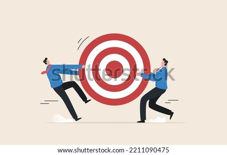 Competitive Strategies for business target. 
Compete for customers. Scramble for market share. Two businessmen fighting for a dartboard goal, target. Royalty-Free Stock Photo #2211090475
