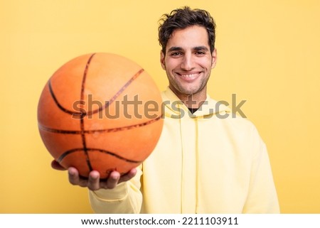 young handsome hispanic man. basketball concept
