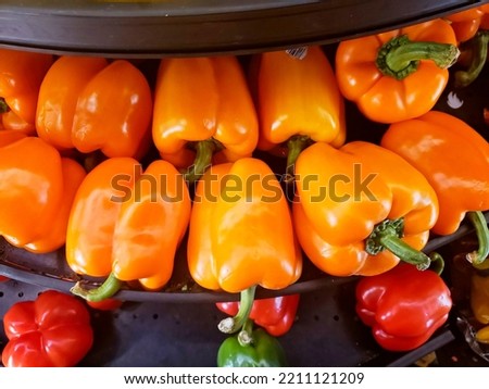 Bell peppers on a shelf in reach in cooler Royalty-Free Stock Photo #2211121209