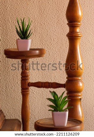 Vertical wooden shelf to place pots as decoration in a small corner