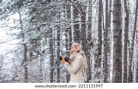 professional photographer outdoor in winter. woman use vintage camera. hobby time outdoor in winter day. admiring winter mountain landscape. Happy tourist woman in winter