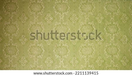 Old wallpaper on the wall. Old wallpaper for texture or background. Royalty-Free Stock Photo #2211139415