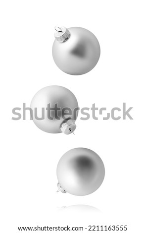 Christmas balls isolated on white background. Set of three falling silver christmas ornaments. Royalty-Free Stock Photo #2211163555