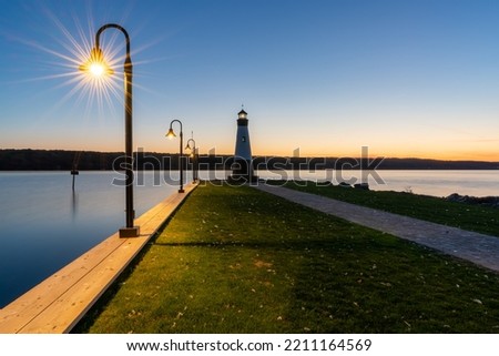 Sunset photo of the Myers Point Lighthouse at Myers Park in Lansing NY, Tompkins County. The lighthouse is situated on the shore of Cayuga Lake, near Ithaca New York.
