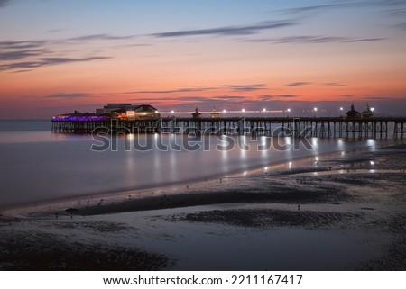 Pier with attraction in the evening after sunset in Blackpool beach. England, UK