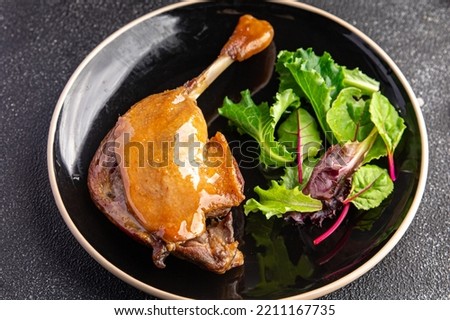 duck leg confit berry sauce second course healthy meal food snack diet on the table copy space food background rustic top view