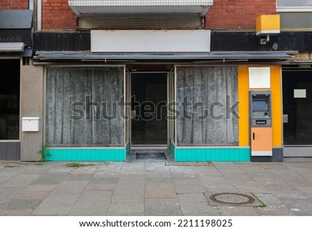 closed shop, locked store front, many shops remain empty due to the coronavirus pandemic and the subsequent economic downturn.