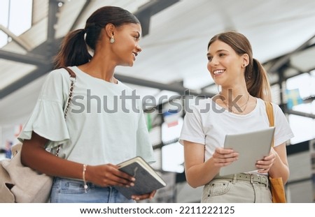 University, communication and students talking about education with tablet and notebook on campus together. Diversity at college with friends speaking while walking so study for project with tech