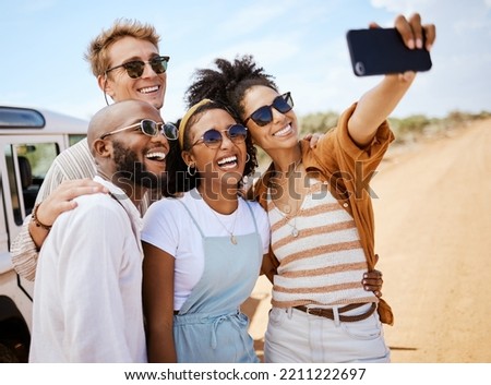 Safari, travel and friends phone selfie for social media with multiracial people on dirt road. Diverse friendship group enjoying bush holiday together in South Africa with smartphone photograph.