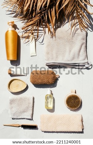 Beautiful photo of spa and skin care products such as oil, cream and other organic products, towels shot in flat lay style on sunlight with contrast shadows