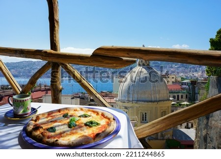 Pizzeria with  Naples city view Royalty-Free Stock Photo #2211244865