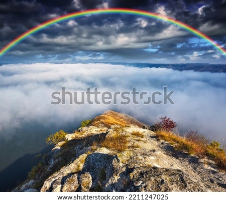 colorful rainbow over river canyon. autumn landscape. nature of Ukraine 