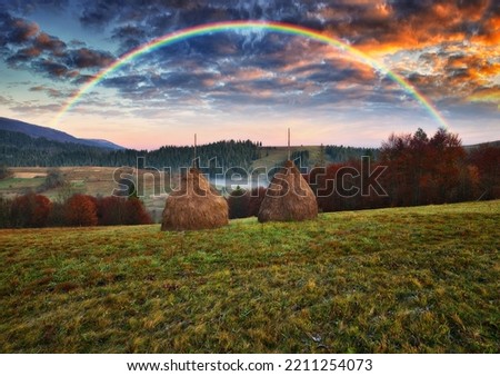 Rainbow over the Mountains. autumn morning in the Carpathians. Nature of Ukraine